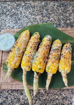 A picture of Cambodian Grilled Corn with coconut cream sauce.