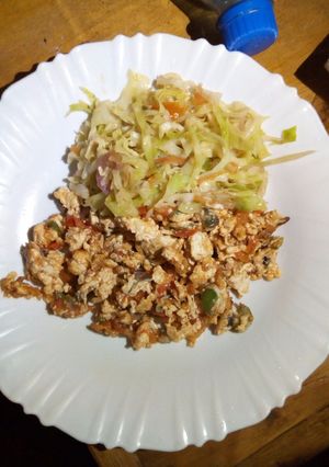A picture of Scrambled eggs and fried cabbage.