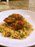 Crispy chicken thighs with lemon fennel and pea orzo