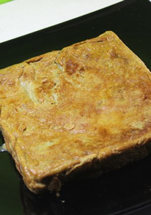 Foto principal de Tortilla cuadrada de alcachofas confitadas