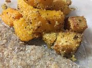 Una foto de polenta y zapallo al horno