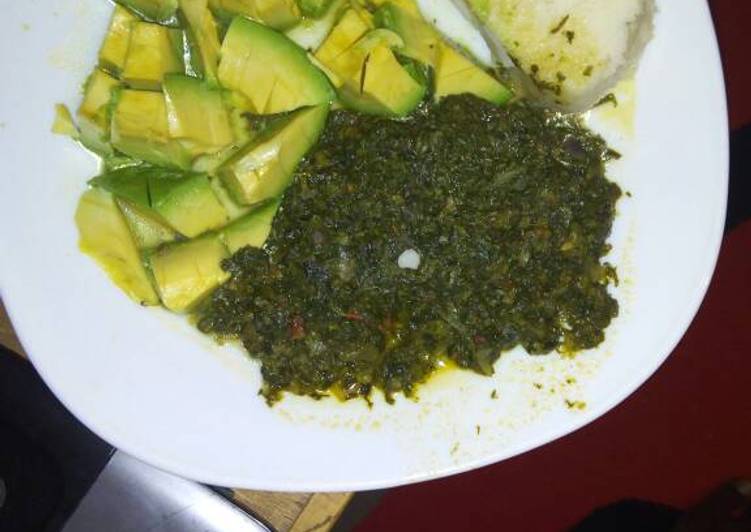 Ugali  with spinach and cabbage served with avocado