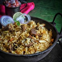 A picture of Thalapakatti style Mutton Biryani.