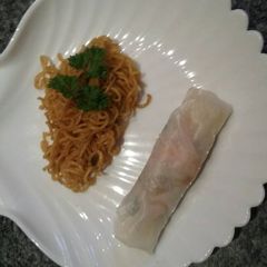 A picture of Almost authentic spring rolls with thai baked soba noodles.