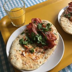 A picture of Dishoom Bacon Naan Rolls.
