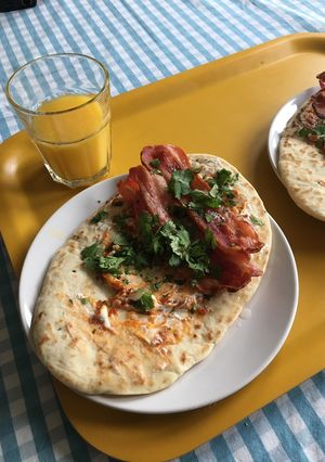 A picture of Dishoom Bacon Naan Rolls.