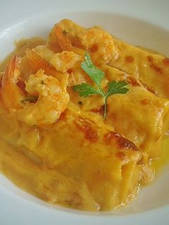 Una foto de Canelones rellenos de alcachofas y langostinos