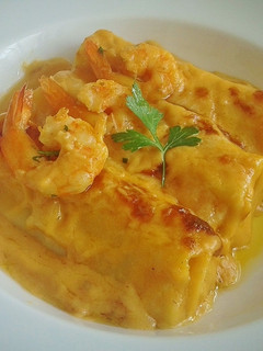 Una foto de Canelones rellenos de alcachofas y langostinos