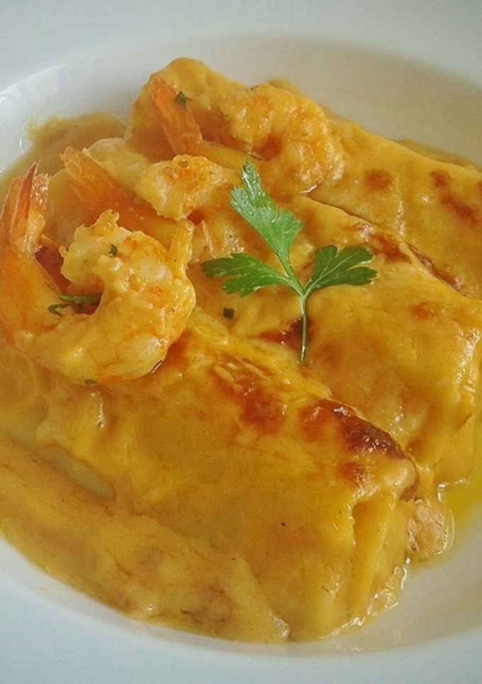 Una foto de Canelones rellenos de alcachofas y langostinos