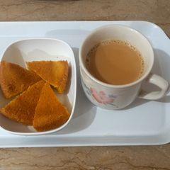 A picture of Tea with honey 🍯.