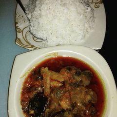 A picture of White rice and local stew.