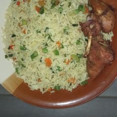 A picture of Fried rice with grilled chicken.