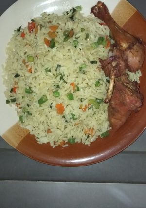 A picture of Fried rice with grilled chicken.