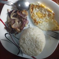 Boiled rice served with onion and egg A picture of Boiled rice served with onion and egg.