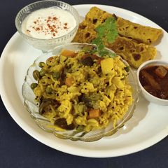 A picture of Masala bhat and masala bhakhri.