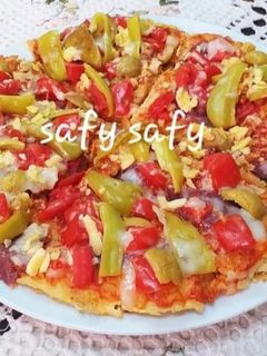 صورة لوصفة بيتزا البطاطس المبشورة(بدون فرن)