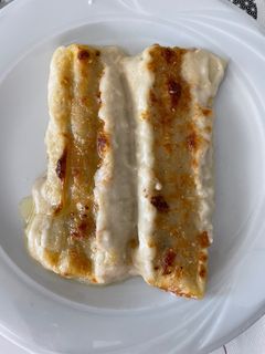 Una foto de Canelones XL de carrillada y boletus