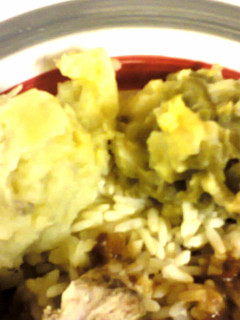 A picture of Mashed potatoes with green beans.