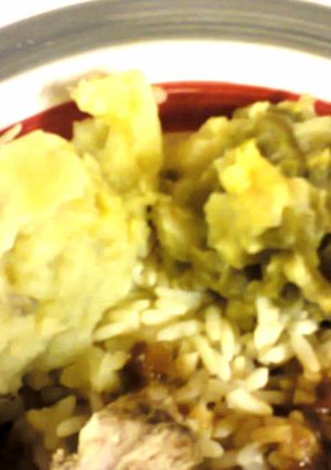 A picture of Mashed potatoes with green beans.