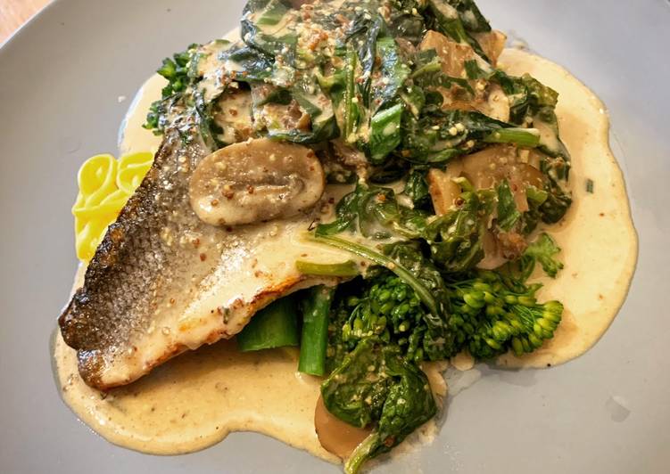 Pan fried Sea Bass with Wholegrain mustard, mushroom & spinach sauce. Finished with wild garlic