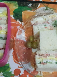 A picture of Three layered / three coloured sandwiches.