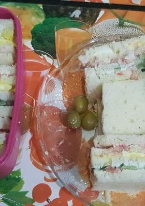 A picture of Three layered / three coloured sandwiches.
