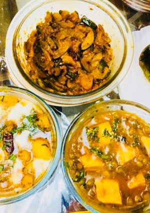 A picture of Potatoes butter Masala,Mutter Paneer,Khatta meetha Kaddu with Spinach Poori.