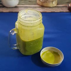A picture of Frozen banana, raw oats, almond milk, and moringa smoothie.