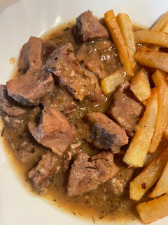 Una foto de Magro de cerdo encebollado