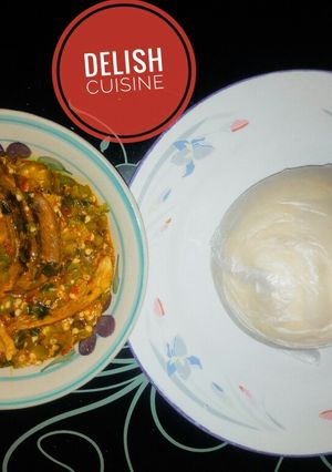 A picture of Okro soup with cassava swallow.