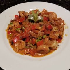A picture of Shrimp & Grit Cakes (Kentucky Bourbon Butter Sauce).