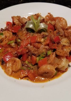 A picture of Shrimp & Grit Cakes (Kentucky Bourbon Butter Sauce).