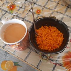 Tomato poha and tea A picture of Tomato poha and tea.