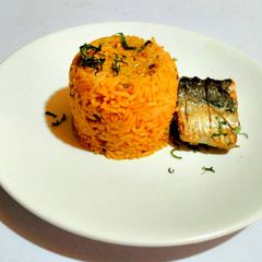 A picture of Pressure Pot Jollof Rice and Beans with Pan Grilled Fish.