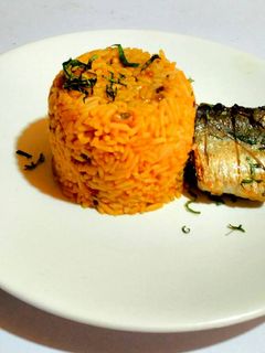 A picture of Pressure Pot Jollof Rice and Beans with Pan Grilled Fish.