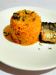 A picture of Pressure Pot Jollof Rice and Beans with Pan Grilled Fish.