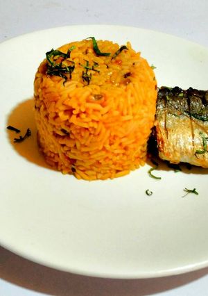 A picture of Pressure Pot Jollof Rice and Beans with Pan Grilled Fish.