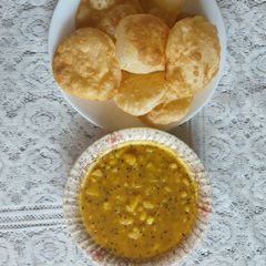 A picture of Poory bhaji / dasi breakfast.
