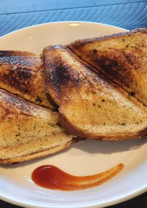 A picture of Grilled Bread Sandwich with Garlic Herb Butter.