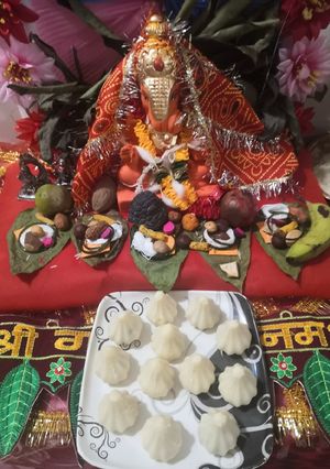 A picture of Stuffed gulkand and coconut jaggery rava modak.