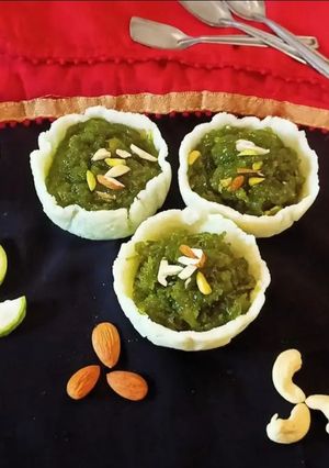 A picture of Bottle gourd Halwa In Coconut basket.