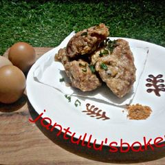 A picture of Chicken in fry eggs.