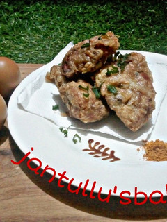 A picture of Chicken in fry eggs.