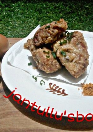 A picture of Chicken in fry eggs.