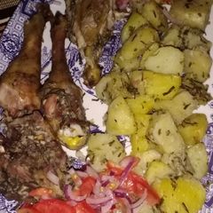 A picture of Oven roasted potatoes and chicken.