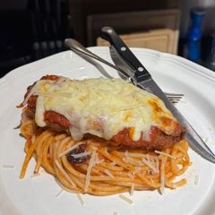 A picture of Chicken Parmesan with Spaghetti.