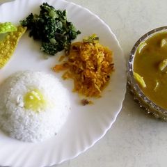 Plain rice with radish sambar, carrot podimas and palak poriyal A picture of Plain rice with radish sambar, carrot podimas and palak poriyal.