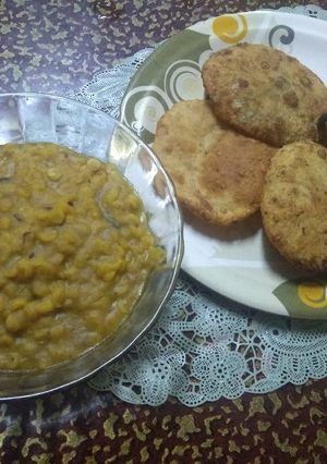 A picture of Karaisutir kachuri and mishti cholar daal.