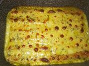 Una foto di cannelloni con besciamella