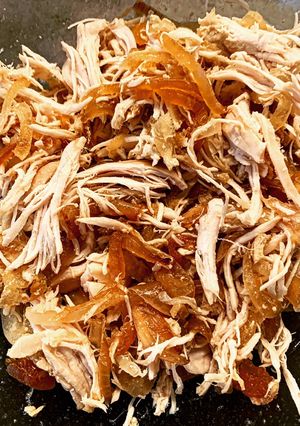 A picture of Pulled Chicken in the Crockpot.